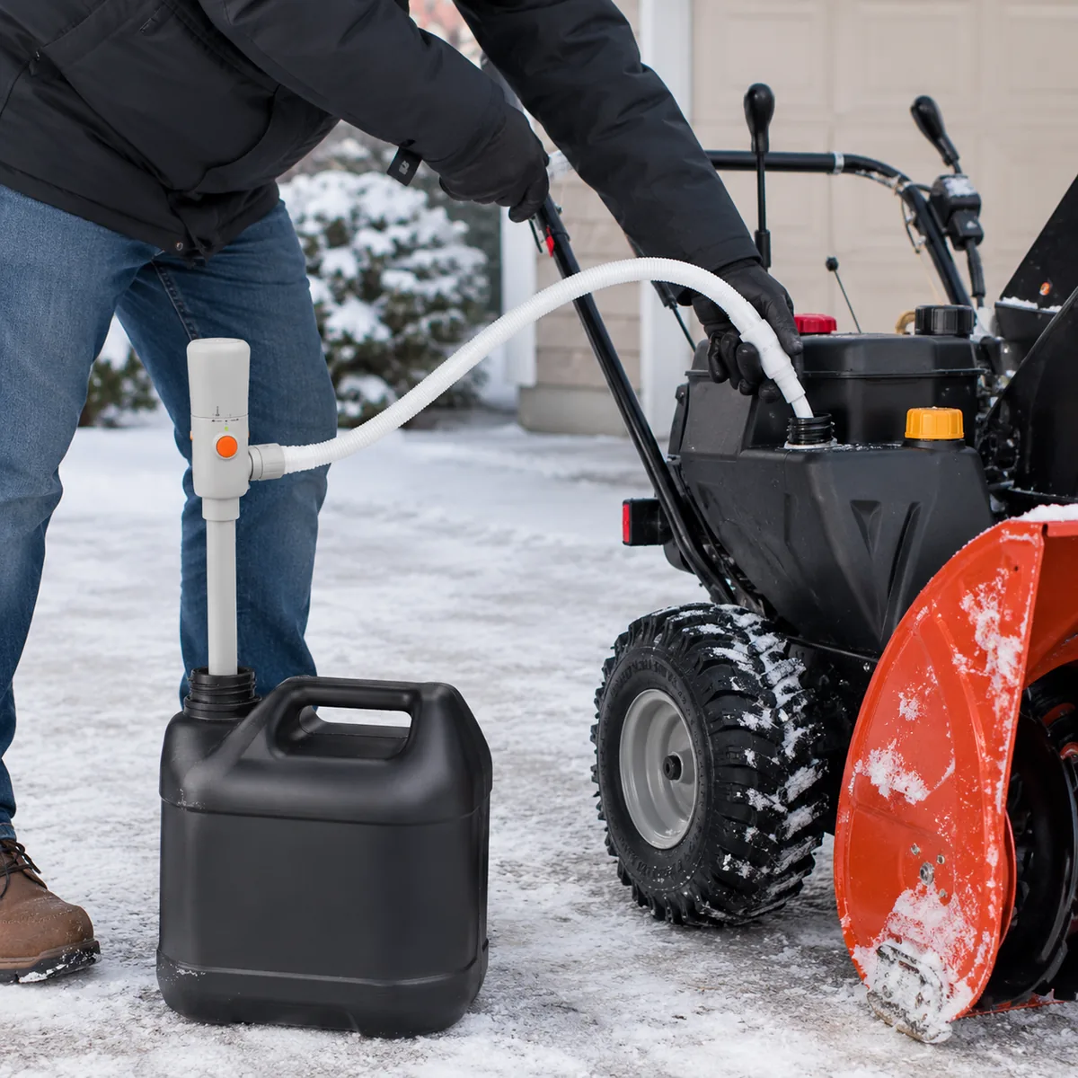 FN201 portable pump refueling a snow blower in snow
